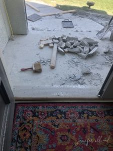 crumbled concrete in front step area