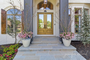 gold front door and bluestone pavers