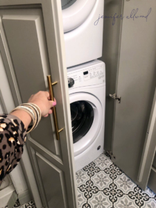 Door to hide stackable washer and dryer in basement bathroom