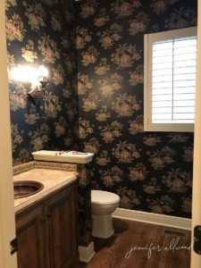 dark wallpaper in bathroom before remodel