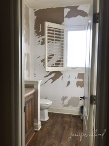 bathroom wall after wallpaper was removed