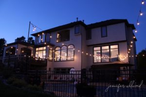 string lights and exterior house paint at dusk
