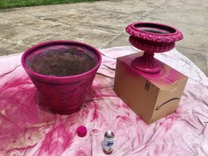 pots being spray painted pink