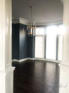dining room "before" photo with navy, grey, and white tones without furniture