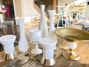 scattered milk glass pieces with gold accents